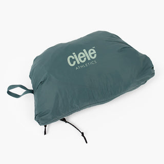 view of the ciele athletics VNTJacket lightweight running jacket for men in silver pine color when folded in one of it's pocket