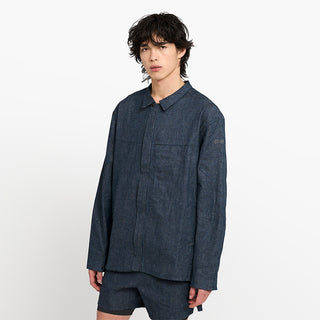 side view of ciele athletics CCJacket unisex running jacket from the Lifestyle Edition collection, in denim indigo color, on a model