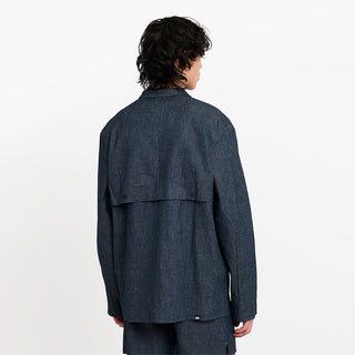 back view of ciele athletics CCJacket unisex running jacket from the Lifestyle Edition collection, in denim indigo color, on a model