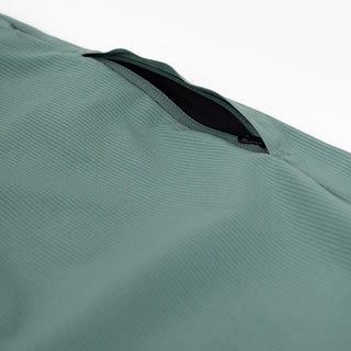 detail view of the zippered leg pocket of the ciele athletics CCPants unisex running pants from the Lifestyle Edition collection, in silver pine color