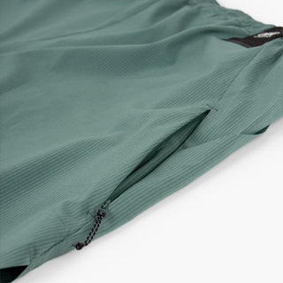 detail view of the hidden side zip pocket of the ciele athletics WRKShort unisex running and technical short from the Lifestyle Edition collection, in silver pine color