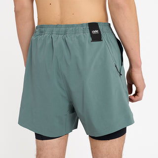 close back view of ciele athletics WRKShort unisex running and technical short from the Lifestyle Edition collection, in silver pine color, on a model