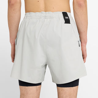 close back view of ciele athletics WRKShort unisex running and technical short from the Lifestyle Edition collection, in light grey color, on a model