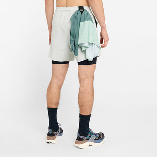 back view of ciele athletics WRKShort unisex running and technical short from the Lifestyle Edition collection, in light grey color, on a model, showing the use of the back loop