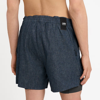 close back view of ciele athletics WRKShort unisex running and technical short from the Lifestyle Edition collection, in denim indigo color, on a model