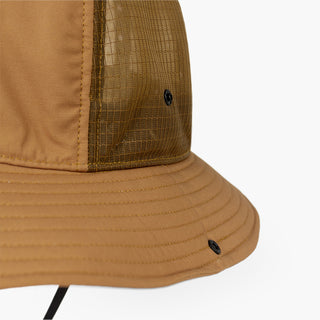 closeup view of the ciele athletics TRLBucket unisex running bucket hat side button closure in dark ochre color
