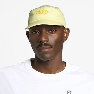 front view of ciele athletics GOCap unisex running hat in glade color on a model