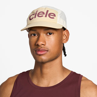 front view of the ciele athletics GOCap unisex running hat in safari color, on a model