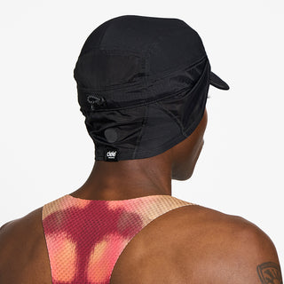 back view of ciele athletics GOCap solar unisex running hat from the Elite collection in shadowcast color, on a model with the side shield unfolded