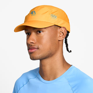 side view of ciele athletics GOCap SC Comp Word Wild Mouvement unisex running hat for the Miami marathon on a model