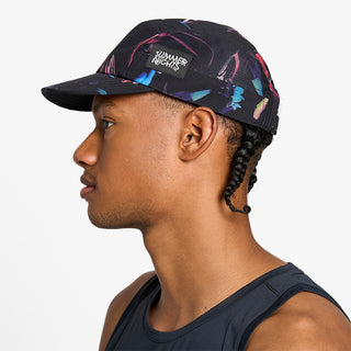 side view of the ciele athletics GOCap unisex running hat in summer nights limited edition, on a model
