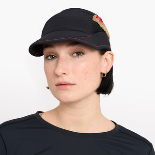 front view of ciele athletics new FSTCap ethereal unisex running hat from the Elite collection in shadowsphinx color, on a model