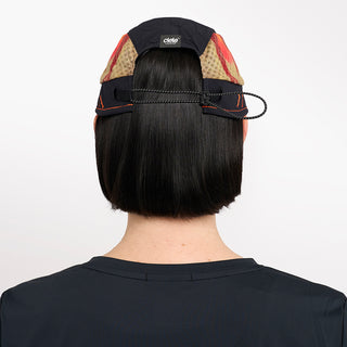 back view of ciele athletics new FSTCap ethereal unisex running hat from the Elite collection in shadowsphinx color, on a model