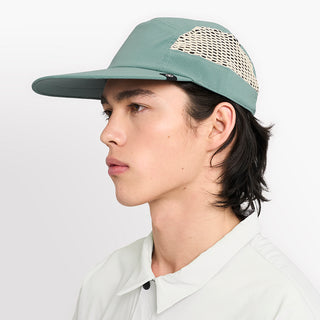 side view of ciele athletics GOCap longbrim unisex running hat with longer brim from the Lifestyle Edition collection, in silver pine color, on a model