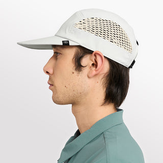 side view of ciele athletics GOCap longbrim unisex running hat with longer brim from the Lifestyle Edition collection, in light grey color, on a model