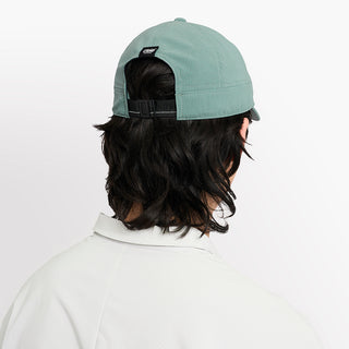 back view of ciele athletics CRWCap short brim unisex running hat with shorter brim from the Lifestyle Edition collection, in silver pine color, on a model