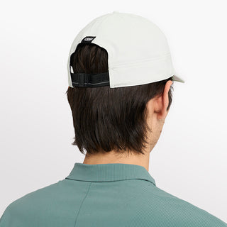 back view of ciele athletics CRWCap short brim unisex running hat with shorter brim from the Lifestyle Edition collection, in light grey color, on a model