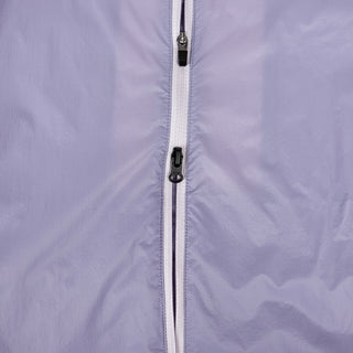 closeup view of the double sided zipper of the ciele athletics VNTJacket lightweight running jacket for women in grape color