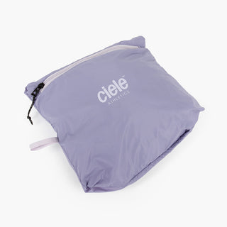 view of the ciele athletics VNTJacket lightweight running jacket for women in grape color when folded in one of it's pocket