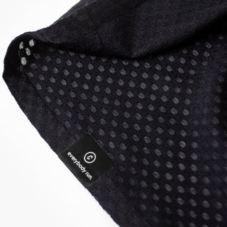 close up of the ciele branding of the ciele athletics lightweight, race ready and performance driven Singlet for womens named RDCRPSinglet in shadowsphinx color