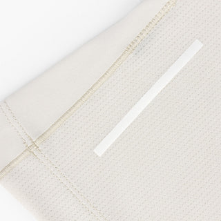 close view of the back reflective detail on the ciele athletics DLYTSinglet lightweight and performance driven singlet in rainy day