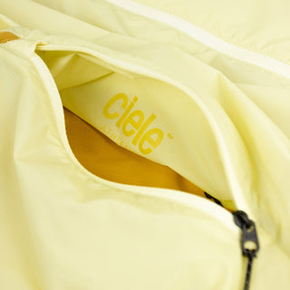 closeup view of the inside pocket logo of the ciele athletics VNTJacket lightweight running jacket for men in glade color