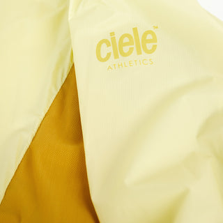 closeup view of the reflective sleeve logo of the ciele athletics VNTJacket lightweight running jacket for men in glade color