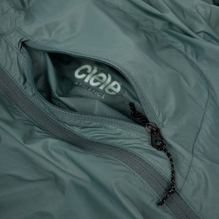 closeup view of the inside pocket logo of the ciele athletics VNTJacket lightweight running jacket for men in silver pine color