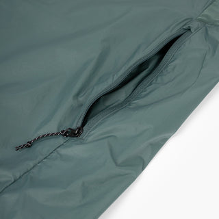 closeup view of the zippered side pocket of the ciele athletics VNTJacket lightweight running jacket for men in silver pine color