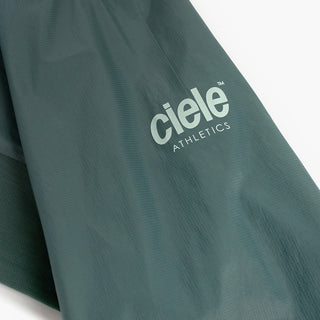 closeup view of the reflective sleeve logo of the ciele athletics VNTJacket lightweight running jacket for men in silver pine color