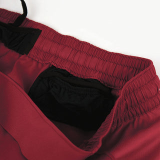 close view of the hidden inside pocket of the ciele athletics TRNShort 7 inch linerless short in merlot color