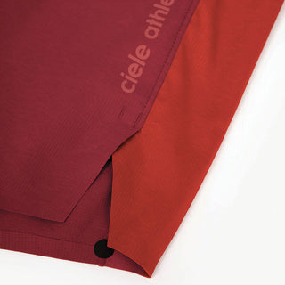 close view of the logo and fabric on the ciele athletics TRNShort 7 inch linerless short in merlot color