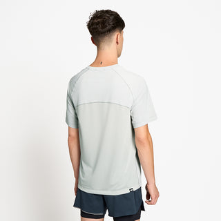 back view of ciele athletics DLYTShirt lightweight and performance driven T-Shirt in light grey on a model