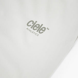 close view of the reflective logo on the ciele athletics DLYTSinglet lightweight and performance driven singlet in light grey