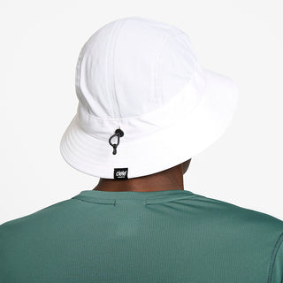 back view of ciele athletics GOBucket Comp Athletics unisex running bucket hat in ghost color on a model