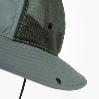 closeup view of the ciele athletics TRLBucket unisex running bucket hat side button closure in silver pine color