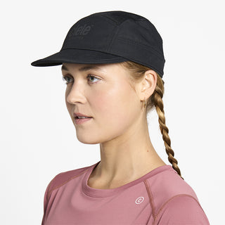 side view of ciele athletics GOCap unisex running hat in shadowcast color on a model