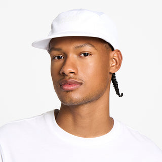 front view of the ciele athletics GOCap unisex running hat in ghost color, on a model