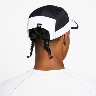 back view of the ciele athletics GOCap unisex running hat with a curved brim in trooper color, on a model