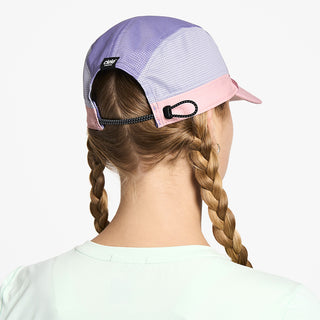 back view of ciele athletics FSTCap SC Field Iconic SL unisex running hat in deco rose light grape color on a model