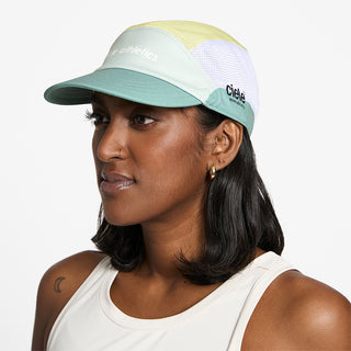 side view of ciele athletics GOCap SC Field Loopy unisex running hat in dusty turquoise color on a model