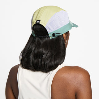 back view of ciele athletics GOCap SC Field Loopy unisex running hat in dusty turquoise color on a model