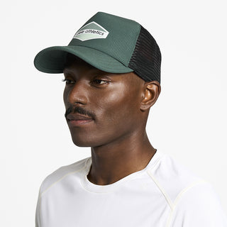 side view of ciele athletics TRLCap SC Field Updown unisex running hat in emerald color on a model