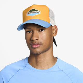 front view of ciele athletics TRLCap SC Field Updown unisex running hat in clementine color on a model