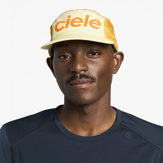 front view of ciele athletics GOCap Comp Century unisex running hat in glade color on a model