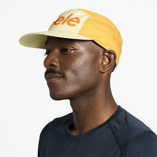 side view of ciele athletics GOCap Comp Century unisex running hat in glade color on a model