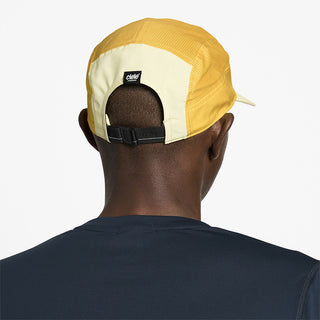 back view of ciele athletics GOCap Comp Century unisex running hat in glade color on a model