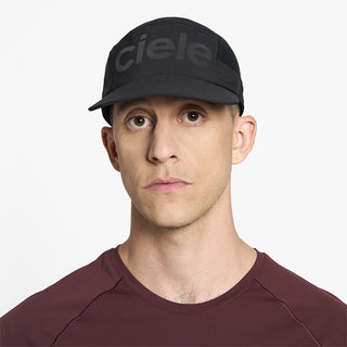 front view of ciele athletics GOCap Comp Century unisex running hat in shadowcast color on a model