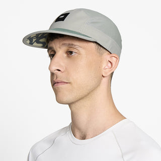 side view of ciele athletics GOCap EQ Frames unisex running hat in neutral grey color on a model