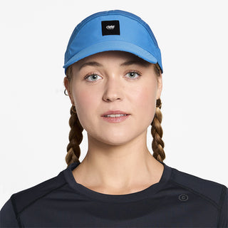 front view of ciele athletics FSTCap SC EQ Frames unisex running hat in palace blue color on a model